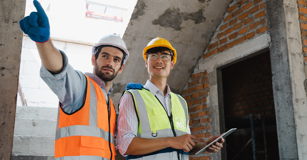 Two Building Inspectors using a tablet to do a mobile digital inspection 